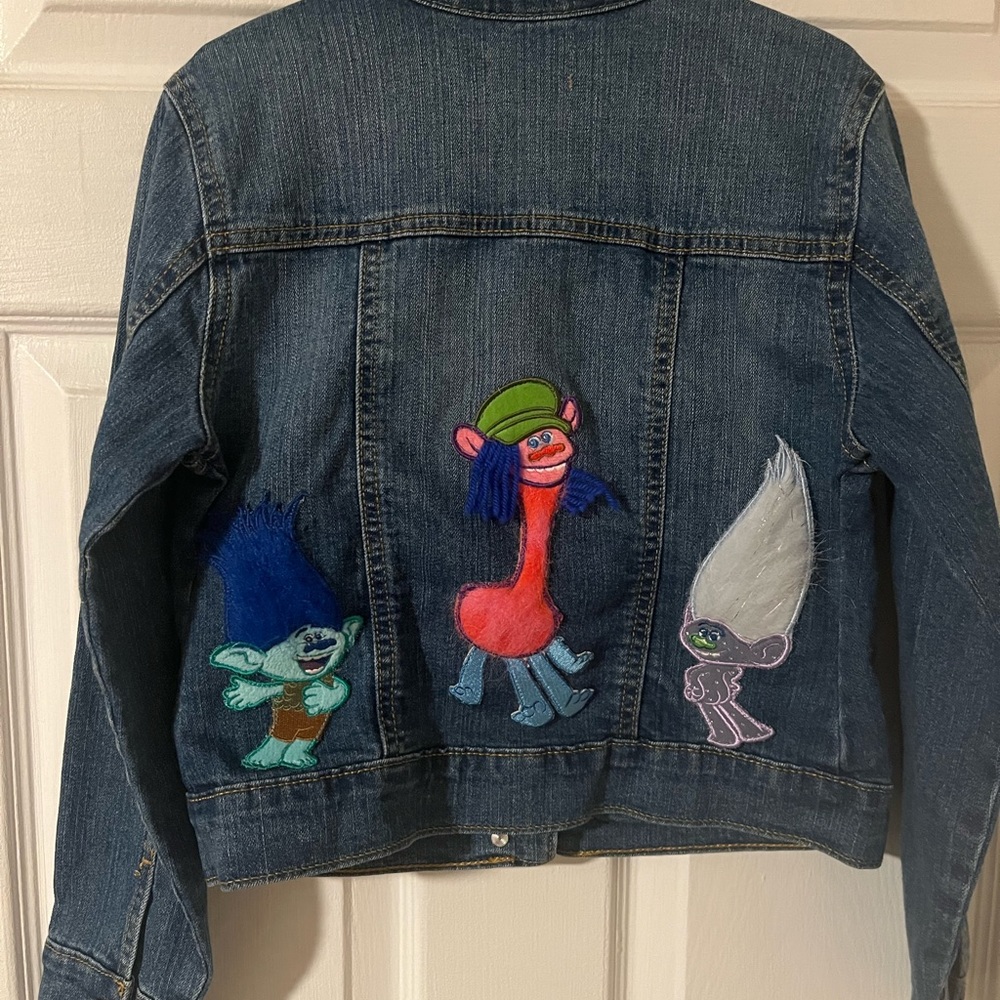 Old navy denim jacket with trolls decals on back